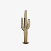 A large metal saguaro cactus, standing 9ft tall, against a white background. The sculpture's intricate design features a realistic saguaro body and arms, creating a lifelike appearance.