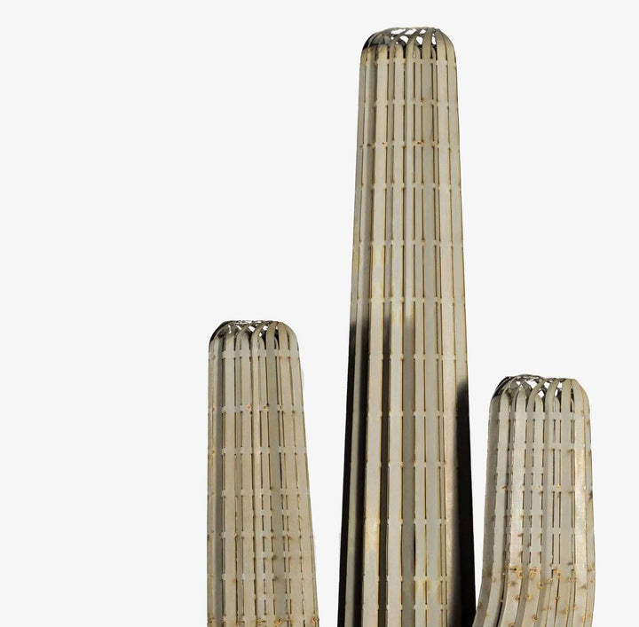 Set of three metallic cactus sculptures on a white background
