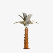A large metal paradise palm tree, standing 10ft tall, against a white background. The sculpture's intricate design features realistic palm fronds and textured trunk, creating a lifelike appearance.