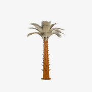 A large metal paradise palm tree, standing 12ft tall, against a white background. The sculpture's intricate design features realistic palm fronds and textured trunk, creating a lifelike appearance.