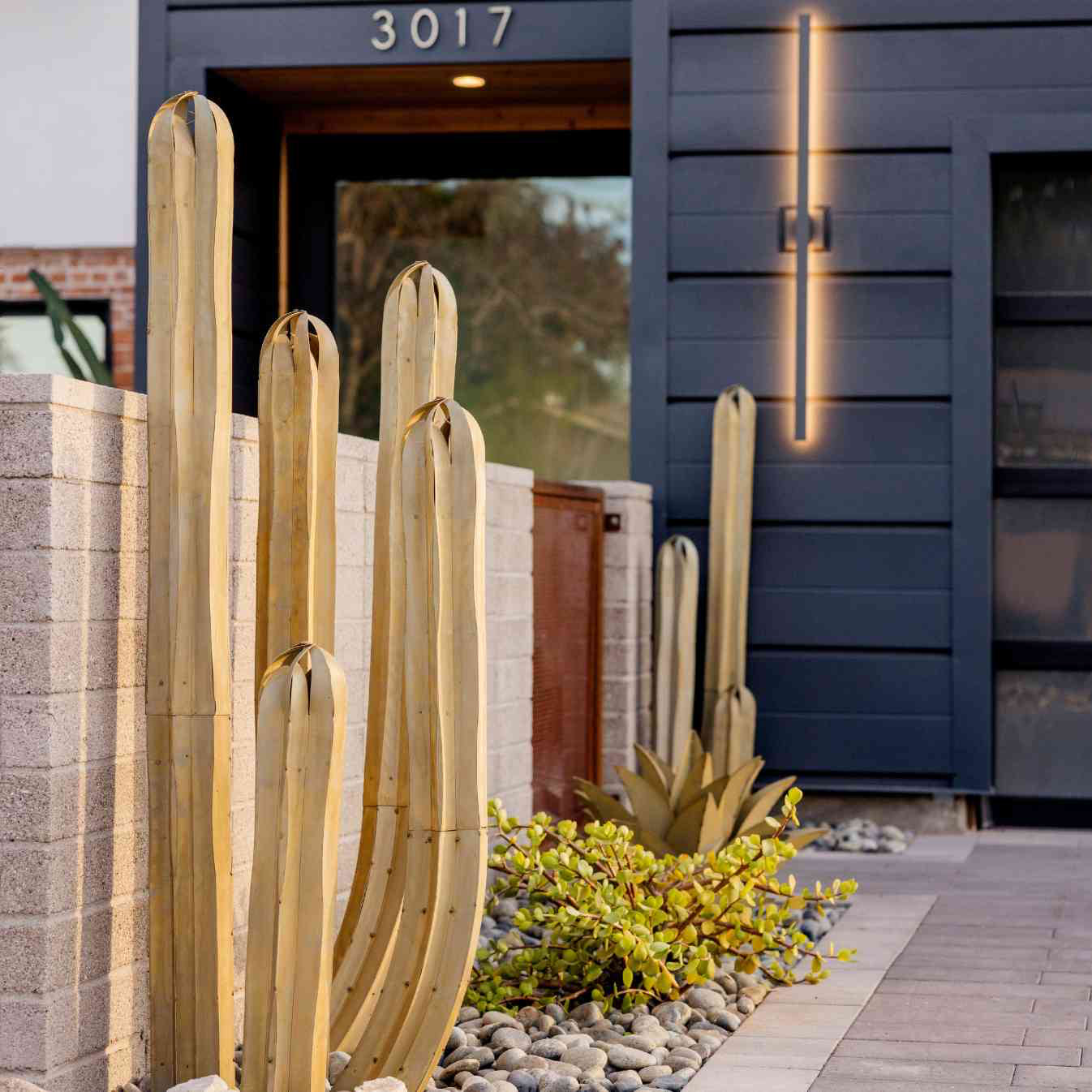 Steel Mexican Fence Post cactus along walkway