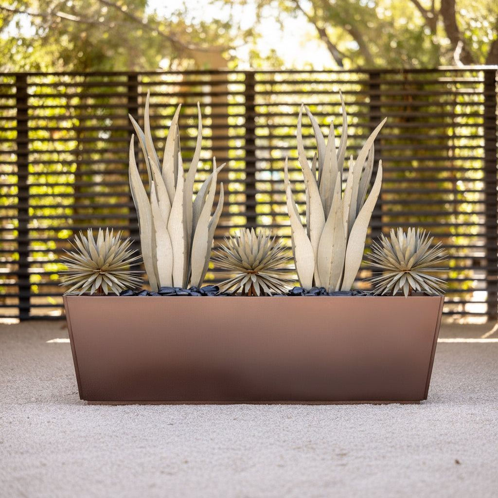 Decorative planter with succulents against a textured wall