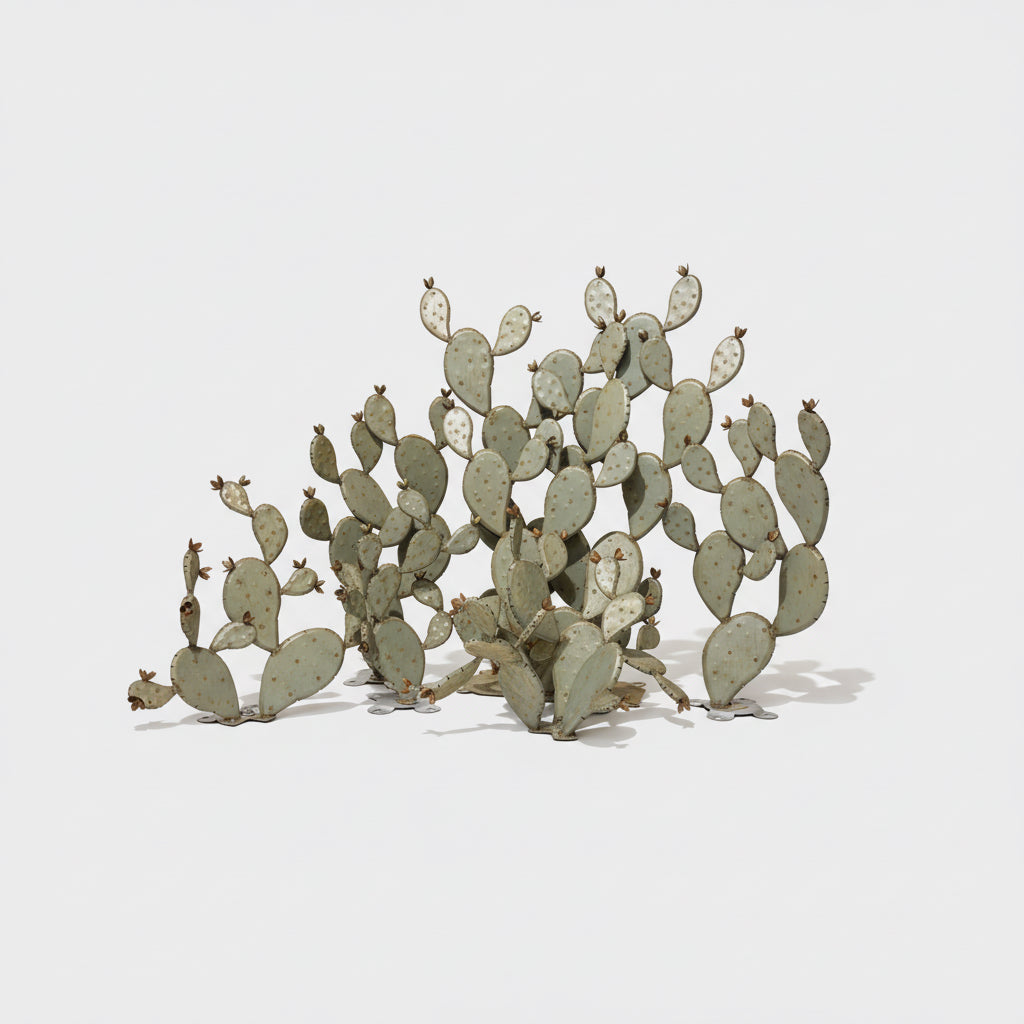 Metal cactus sculpture on a white background