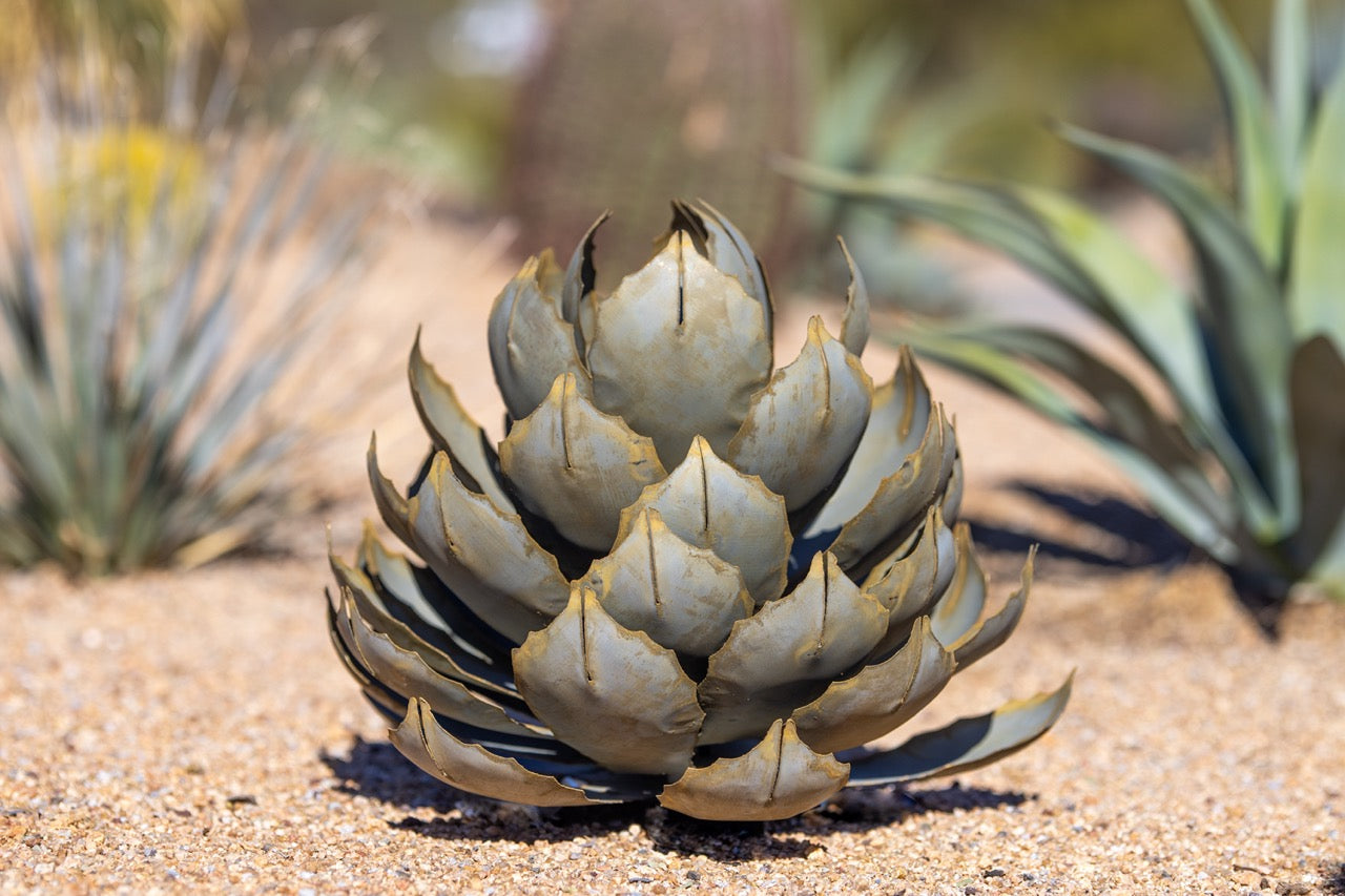 A large handcrafted metal artichoke agave located in the desert.