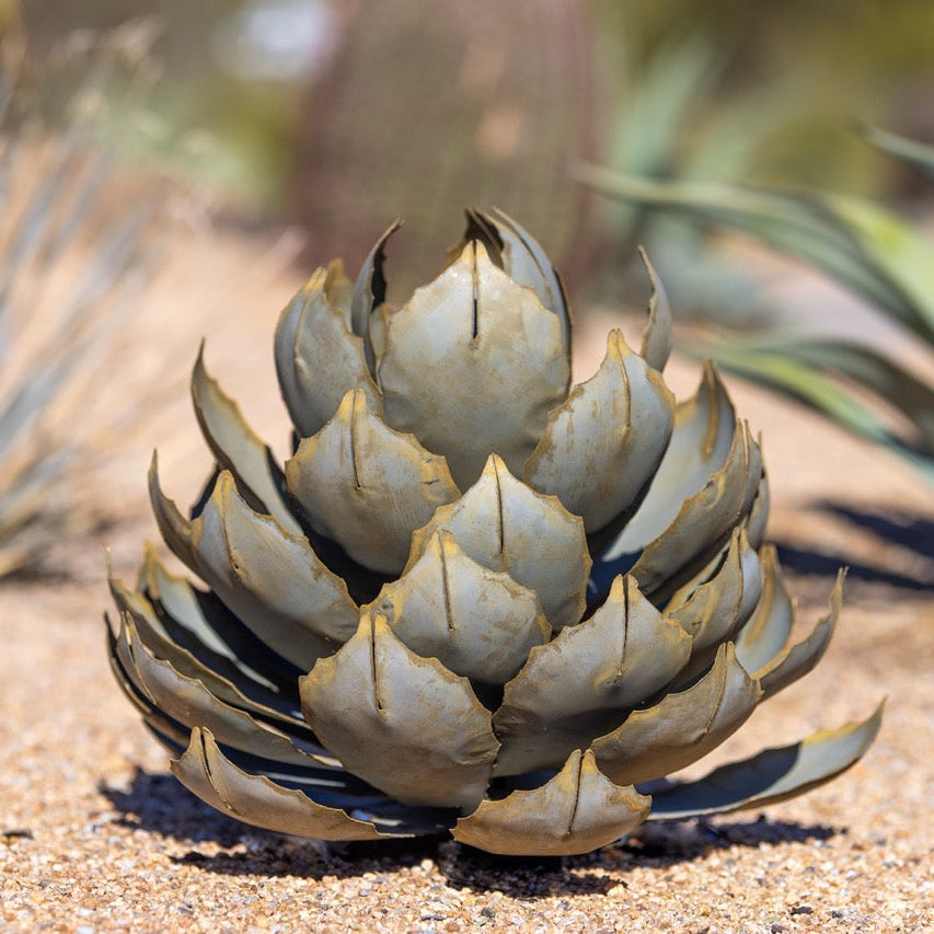 A large handcrafted metal artichoke agave located in the desert.