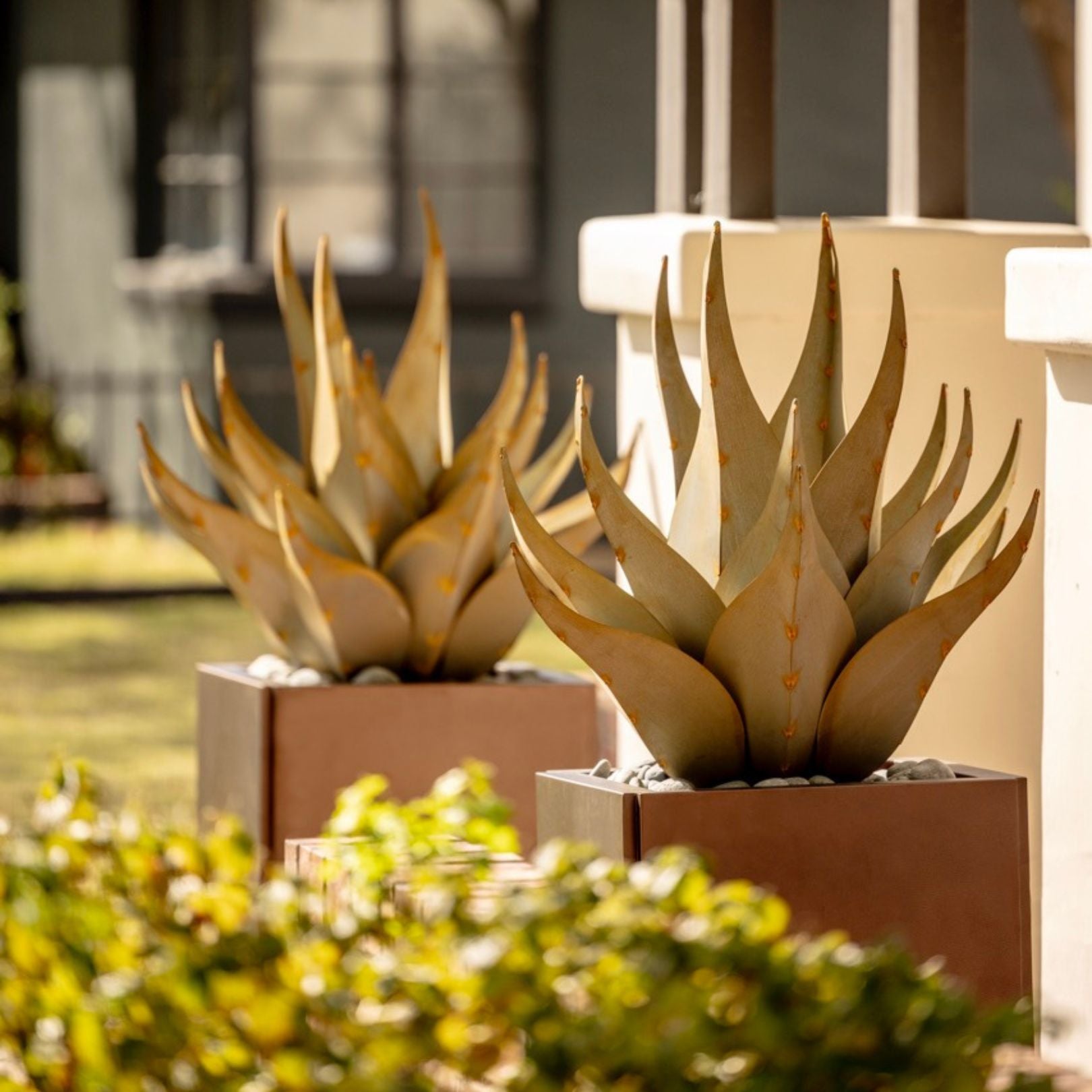 An XL metal sharkskin in shea yard art sculpture, that has been handcrafted with a desert-inspired landscape background.